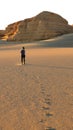 Asian woman female tourist backpacker walking in desert