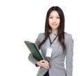 Asian woman with filepad and laptop Royalty Free Stock Photo