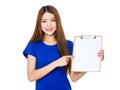 Asian woman finger point to blank page of clipboard Royalty Free Stock Photo
