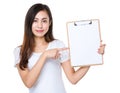 Asian woman finger point to the white paper on clipboard Royalty Free Stock Photo