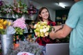 Asian Woman Florist owner of a small florist business holding flowers for delivery to customers at her store Royalty Free Stock Photo