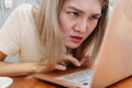 Asian woman focus and concentrate work online in the computer laptop in cafe Royalty Free Stock Photo