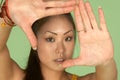 Asian Woman Framing Picture with her Hands