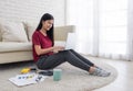 asian woman freelance working on laptop with paperwork at home,work at home concept.online learning concept.