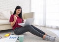 Asian woman freelancer hand up and smile for success working on