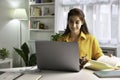 Asian woman freelancer working on computer at home. Attractive businesswoman studying online Royalty Free Stock Photo