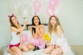 Asian woman friend group attractive sexy,celebrating private party,relaxation on bed white bedroom house full balloons,cheerful