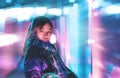 Woman with Futuristic neon cyber punk color tone and background for Cyber and Technology concept, Blue and pink tone