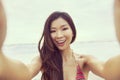 Asian Woman Girl at Beach Taking Selfie Photograph Royalty Free Stock Photo