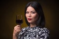 Asian woman with glass of red wine Royalty Free Stock Photo