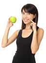 Asian woman with green apple and toothy smile Royalty Free Stock Photo