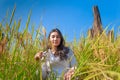 Asian woman in the green rice fields meadow Royalty Free Stock Photo