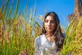 Asian woman in the green rice fields meadow Royalty Free Stock Photo