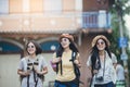 Asian woman group backpacker travel on street together. Royalty Free Stock Photo
