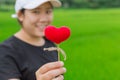 Asian woman hand hold beautiful red heart sweet Royalty Free Stock Photo