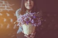 Asian woman hand holding beautiful flowers at coffee shop,Happy and smiling,Relaxing time,Close up Royalty Free Stock Photo