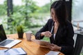 Asian woman hand with pen stylus while using digital tablet for financial analysis Royalty Free Stock Photo