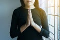 Asian woman with hand in praying position,Female pay respect or put your hands together in a prayer position Royalty Free Stock Photo