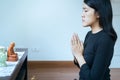 Asian woman with hand in praying position,Female pay respect or put your hands together in a prayer position Royalty Free Stock Photo