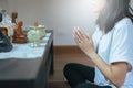 Asian woman with hand in praying worship position,Female prayer hands clasped together Royalty Free Stock Photo