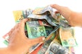 Asian woman hand taking group of colorful australian money banknote dollar AUD pile on white background