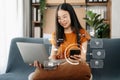 Asian Woman Hand using tablet ,laptop, and holding mobile phone with credit card online banking payment communication network, Royalty Free Stock Photo