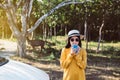 Asian woman hands drinking a glass of hot coffee in the morning at outdoor