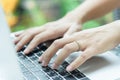 Asian woman hands and married ring has touching and typing on la Royalty Free Stock Photo