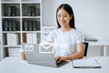 Asian Woman hands using Laptop, tablet typing on keyboard and surfing the internet with email icon, email marketing concept, send Royalty Free Stock Photo
