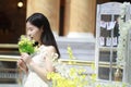 Asian Woman happily Wearing a white dress rise her head smile looking Royalty Free Stock Photo