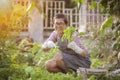 asian woman happiness emotion relaxing in home gardening activities
