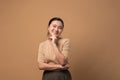 Asian woman happy confident on beige background