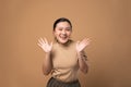 Asian woman happy confident on beige background