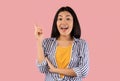 Asian woman has great idea and points up Royalty Free Stock Photo