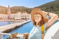 Asian woman in hat enjoying travel and vacation on Cruise ship. Tourist girl on the deck Royalty Free Stock Photo