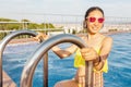 Asian Woman in hat nejoying vacation in swimming pool on the roof Royalty Free Stock Photo