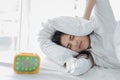 Asian woman hates waking up early in the morning. Sleepy girl lo Royalty Free Stock Photo