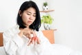 Asian woman have problem with itchy rash scratching her hands