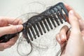 Asian woman have problem with long hair loss attach to comb brush Royalty Free Stock Photo