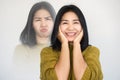 Asian woman having double personality ,mood swings or bipolar disorder with different emotions moody, happy face