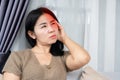 Asian woman having migraine headache feeling pain in one side of her head Royalty Free Stock Photo