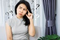 Asian woman having problem with Obsessive-Compulsive Disorder, forgetful and Alzheimer concept with question mark in her mind Royalty Free Stock Photo