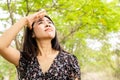 Asian woman having problem sunburn ,melasma, freckles on skin, hand cover her face to protect UV sunlight