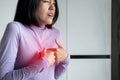 Asian woman having or symptomatic reflux acids,Gastroesophageal reflux disease,Because the esophageal sphincter that separates the Royalty Free Stock Photo