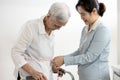 Asian woman helping elderly mother measuring bust waist hip length for new dress of old senior to order made a tailoring online