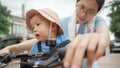 Asian woman and her toddler son riding the bicycle Royalty Free Stock Photo