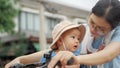 Asian woman and her toddler son riding the bicycle Royalty Free Stock Photo