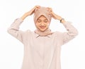 Asian woman in hijab holding and scratch her head Royalty Free Stock Photo