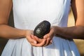 Asian woman holding avocado Royalty Free Stock Photo