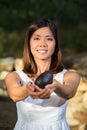 Asian woman holding avocado Royalty Free Stock Photo